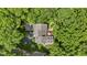 Stunning aerial view of the house nestled amidst mature trees, showcasing its privacy and charm at 7426 Shadow Wood Dr, Indianapolis, IN 46254