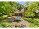 Enjoy the outdoors in this expansive backyard with mature trees and outdoor patio at 7426 Shadow Wood Dr, Indianapolis, IN 46254