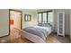 Comfortable bedroom featuring a large window with views of the outdoors, lots of space and modern decor at 7426 Shadow Wood Dr, Indianapolis, IN 46254