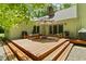 Inviting outdoor deck with comfortable seating, perfect for enjoying the natural surroundings at 7426 Shadow Wood Dr, Indianapolis, IN 46254