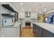 Well-lit kitchen with stainless steel appliances, modern cabinets, and granite counters with lots of workspace at 7426 Shadow Wood Dr, Indianapolis, IN 46254