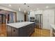 Modern kitchen features a large island, stainless steel appliances, and plenty of cabinet space at 7426 Shadow Wood Dr, Indianapolis, IN 46254