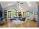 Bright living room with a large window, skylights, and hardwood floors at 7426 Shadow Wood Dr, Indianapolis, IN 46254