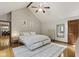 Vaulted ceilings, wood floors, and light gray decor complete this modern bedroom with a ceiling fan at 7426 Shadow Wood Dr, Indianapolis, IN 46254