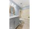 This bathroom is equipped with a tub-shower combo, single sink vanity, and a light fixture at 7630 Blain Way, Indianapolis, IN 46254