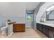 This bathroom features dual vanities, a toilet, and hardwood floors at 7630 Blain Way, Indianapolis, IN 46254