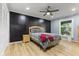 Comfortable bedroom with natural light, ceiling fan, and neutral decor create a cozy retreat at 7630 Blain Way, Indianapolis, IN 46254