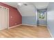 Well-lit bedroom with vaulted ceiling, ample storage, and hardwood floors at 7630 Blain Way, Indianapolis, IN 46254
