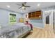Bright bedroom with ample natural light and built-in shelving offers both style and functionality at 7630 Blain Way, Indianapolis, IN 46254
