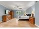 This bedroom offers hardwood floors, bedside tables, a comfortable bed, and dresser at 7630 Blain Way, Indianapolis, IN 46254