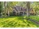 Charming two-story home with a well-manicured lawn, blue siding, and stone accents at 7630 Blain Way, Indianapolis, IN 46254