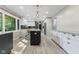 Modern kitchen with granite countertops, stainless steel appliances, and a black backsplash at 7630 Blain Way, Indianapolis, IN 46254
