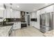 Well-equipped kitchen with stainless steel appliances, granite counters, and ample cabinetry at 7630 Blain Way, Indianapolis, IN 46254