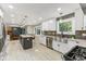 Updated kitchen offering eat-in island, modern fixtures, and stainless steel appliances at 7630 Blain Way, Indianapolis, IN 46254