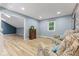 Cozy living room with chair seating and abundant natural light at 7630 Blain Way, Indianapolis, IN 46254