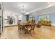 Spacious living and dining area featuring a decorative chandelier and comfortable seating at 7630 Blain Way, Indianapolis, IN 46254