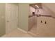 Bathroom featuring a door leading to a tiled shower stall with decorative tile accents at 802 Fern Dr, Shelbyville, IN 46176