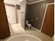 Bathroom with neutral floors, a shower, a toilet, linen closet, and vanity at 802 Fern Dr, Shelbyville, IN 46176