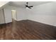 Bright bedroom with wood floors, fresh paint, and doors for easy access at 802 Fern Dr, Shelbyville, IN 46176