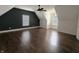 Spacious bedroom featuring beautiful dark hardwood flooring and natural lighting at 802 Fern Dr, Shelbyville, IN 46176
