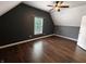 Bedroom showcasing hardwood floors, natural light from a window, and a ceiling fan at 802 Fern Dr, Shelbyville, IN 46176