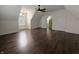 Bright bedroom with wood floors, fresh paint, and doors for easy access at 802 Fern Dr, Shelbyville, IN 46176