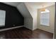 Bright bedroom with wood floors, fresh paint, and natural lighting at 802 Fern Dr, Shelbyville, IN 46176