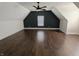 Bedroom featuring hardwood floors, neutral paint, and a ceiling fan for comfort at 802 Fern Dr, Shelbyville, IN 46176