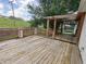 Large backyard deck with a pergola, offering outdoor living space at 802 Fern Dr, Shelbyville, IN 46176