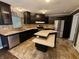 Updated kitchen featuring stainless steel appliances, dark cabinetry, and a unique island at 802 Fern Dr, Shelbyville, IN 46176