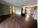 Open-concept living area featuring hardwood floors and seamless flow to other parts of the home at 802 Fern Dr, Shelbyville, IN 46176