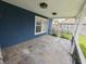 Cozy covered porch featuring a slate tiled floor, offering a pleasant outdoor retreat at 802 Fern Dr, Shelbyville, IN 46176