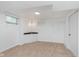 Basement space with plush carpet, a utility sink, and a unique chandelier at 8205 Picadilly Ln, Indianapolis, IN 46256