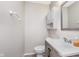 This bathroom features a modern sink, tiled floors, a large mirror, and medicine cabinet at 8205 Picadilly Ln, Indianapolis, IN 46256