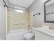 Bathroom featuring a tub-shower combination, white vanity, and bright overhead lighting at 8205 Picadilly Ln, Indianapolis, IN 46256