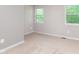 Neutral bedroom with plush carpeting and bright windows offering ample natural light at 8205 Picadilly Ln, Indianapolis, IN 46256
