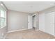 Spacious bedroom featuring neutral walls, plush carpeting, and double closets for ample storage at 8205 Picadilly Ln, Indianapolis, IN 46256