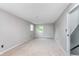 This bedroom features plush carpet, two windows for natural light, and neutral paint at 8205 Picadilly Ln, Indianapolis, IN 46256