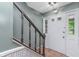 The home's entryway features tile floors, a staircase, and a white door with glass panes at 8205 Picadilly Ln, Indianapolis, IN 46256