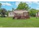 View of house highlighting the deck and backyard at 8205 Picadilly Ln, Indianapolis, IN 46256