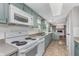 The kitchen includes granite countertops, a double sink, a white oven, and ample cabinet space at 8205 Picadilly Ln, Indianapolis, IN 46256