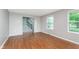 The living room boasts hardwood flooring, light gray walls, and ample natural light at 8205 Picadilly Ln, Indianapolis, IN 46256