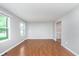 Bright living room with hardwood floors, neutral paint, and large windows for natural light at 8205 Picadilly Ln, Indianapolis, IN 46256