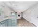 Open-concept kitchen with view to fireplace, dining and living rooms, and tiled and hard wood floors at 8205 Picadilly Ln, Indianapolis, IN 46256
