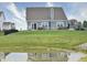 Relaxing backyard view with pond, patio seating, and lush lawn, ideal for enjoying the outdoors at 925 Bent Branch Cir, Greenwood, IN 46143