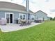 Enjoy outdoor gatherings on the backyard patio with a dining table and chairs and easy access to the hot tub at 925 Bent Branch Cir, Greenwood, IN 46143