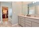 This bathroom boasts double sinks, granite countertops, and a walk-in closet for a clean and modern look at 925 Bent Branch Cir, Greenwood, IN 46143