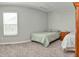 This bedroom includes a window for natural lighting and soft carpeting for a relaxed and cozy atmosphere at 925 Bent Branch Cir, Greenwood, IN 46143