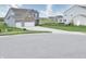 Two-story home in a suburban neighborhood with a well-maintained lawn and view of a nearby pond at 925 Bent Branch Cir, Greenwood, IN 46143