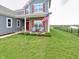Inviting front porch with seating, charming shutters, and manicured lawn, perfect for enjoying the outdoors at 925 Bent Branch Cir, Greenwood, IN 46143